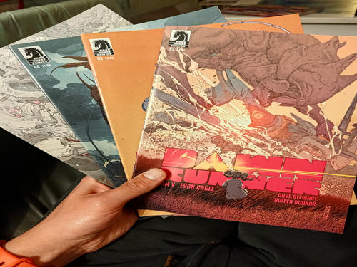 a stack of dawn runner comic books