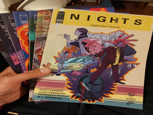a stack of nights comic books