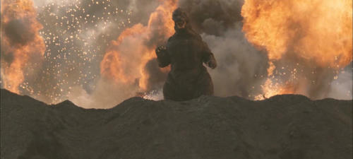 Godzilla in front of explosions