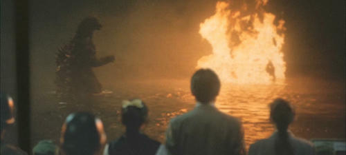 Godzilla facing Biollante on fire