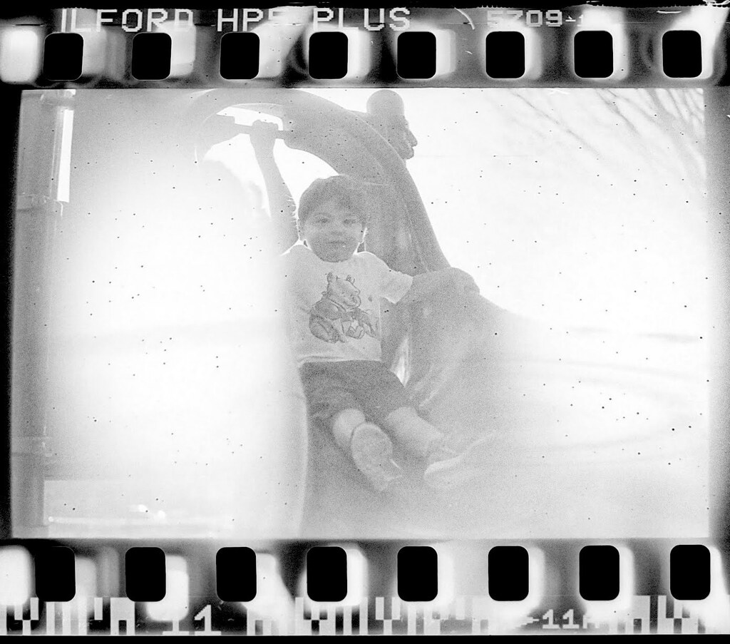 Another jank photo of my kid on a slide