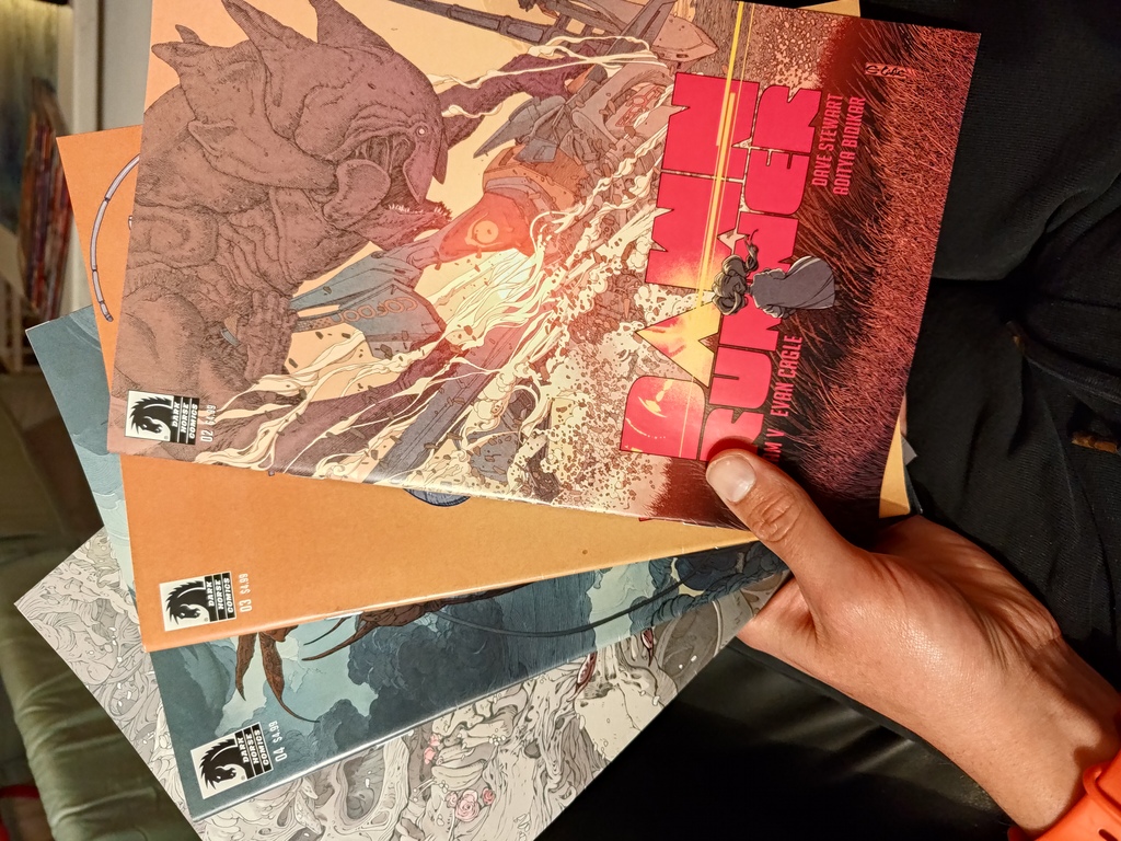a stack of dawn runner comic books