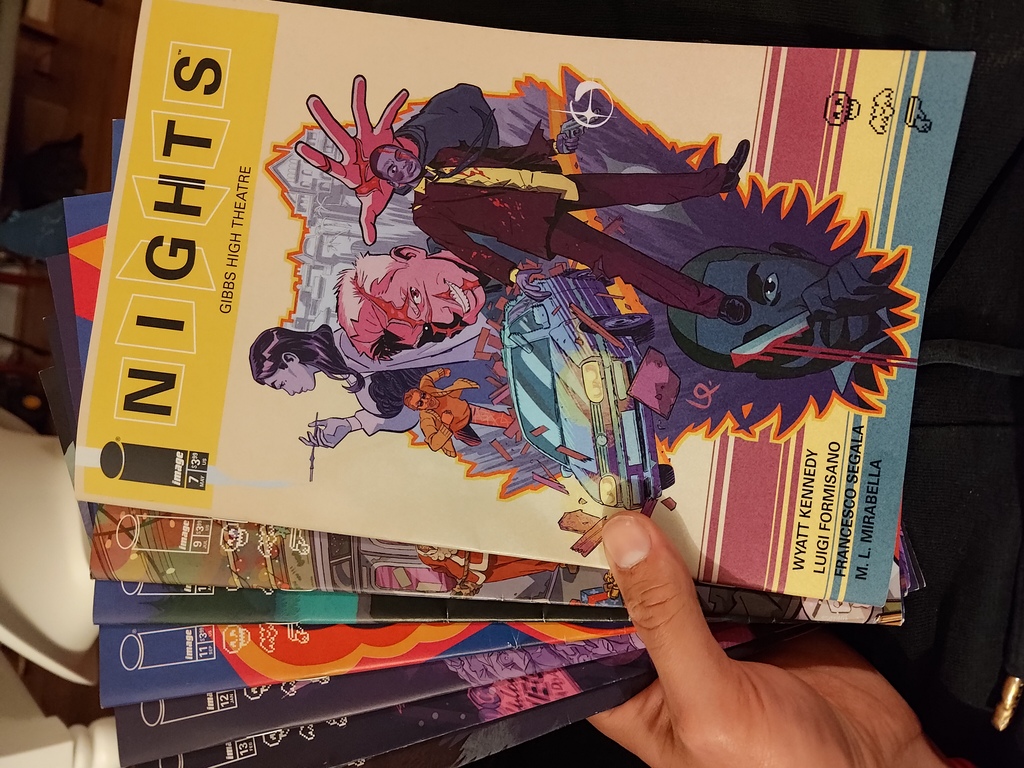 a stack o fnights comic books